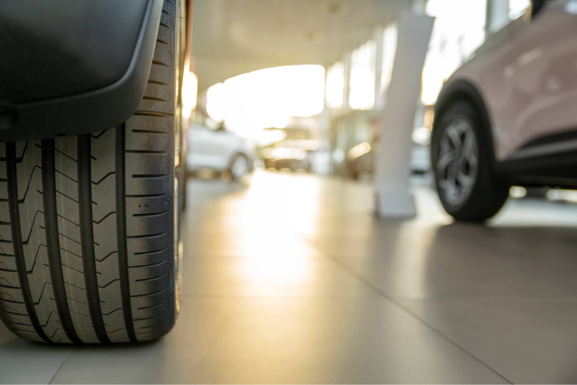An Albany Motorcars team member handing keys to a customer