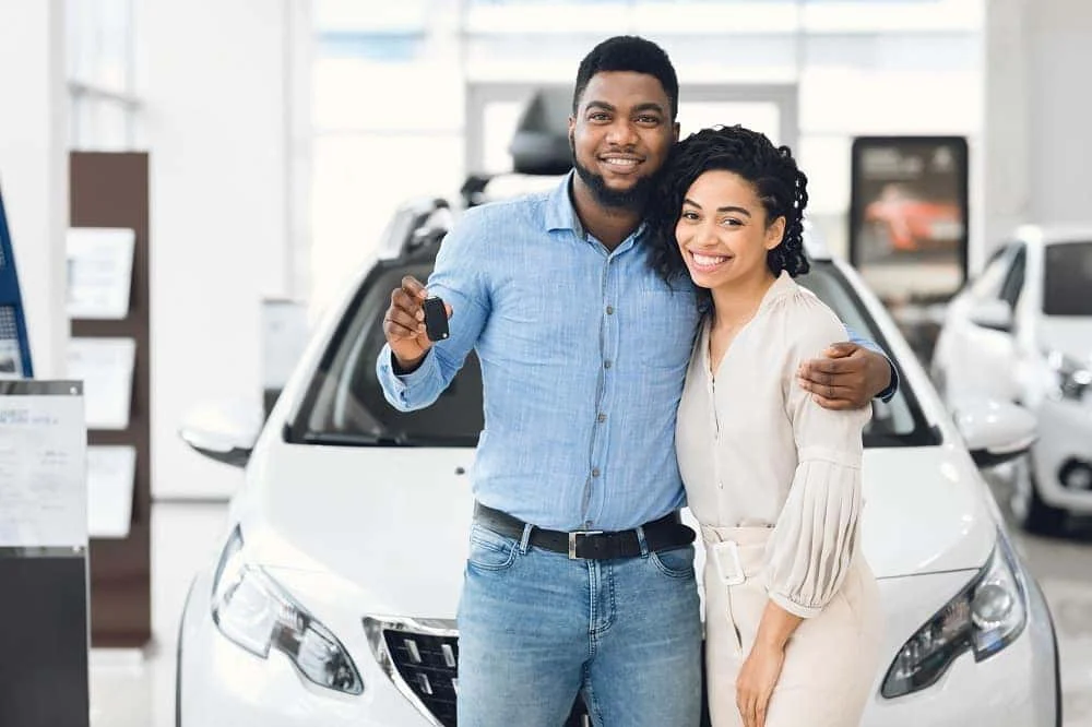 Appraiser reviewing a vehicle with a customer at Albany Motorcars