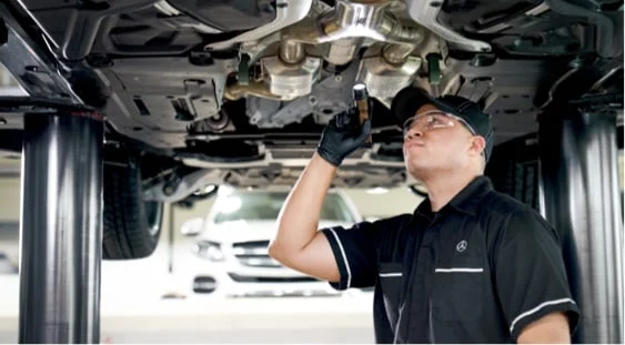 Technician installing Genuine Mercedes-Benz Parts
