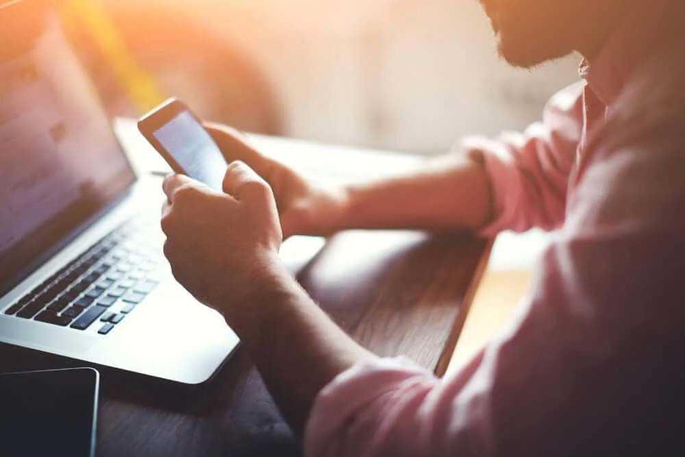 Customer completing an online finance application on his phone