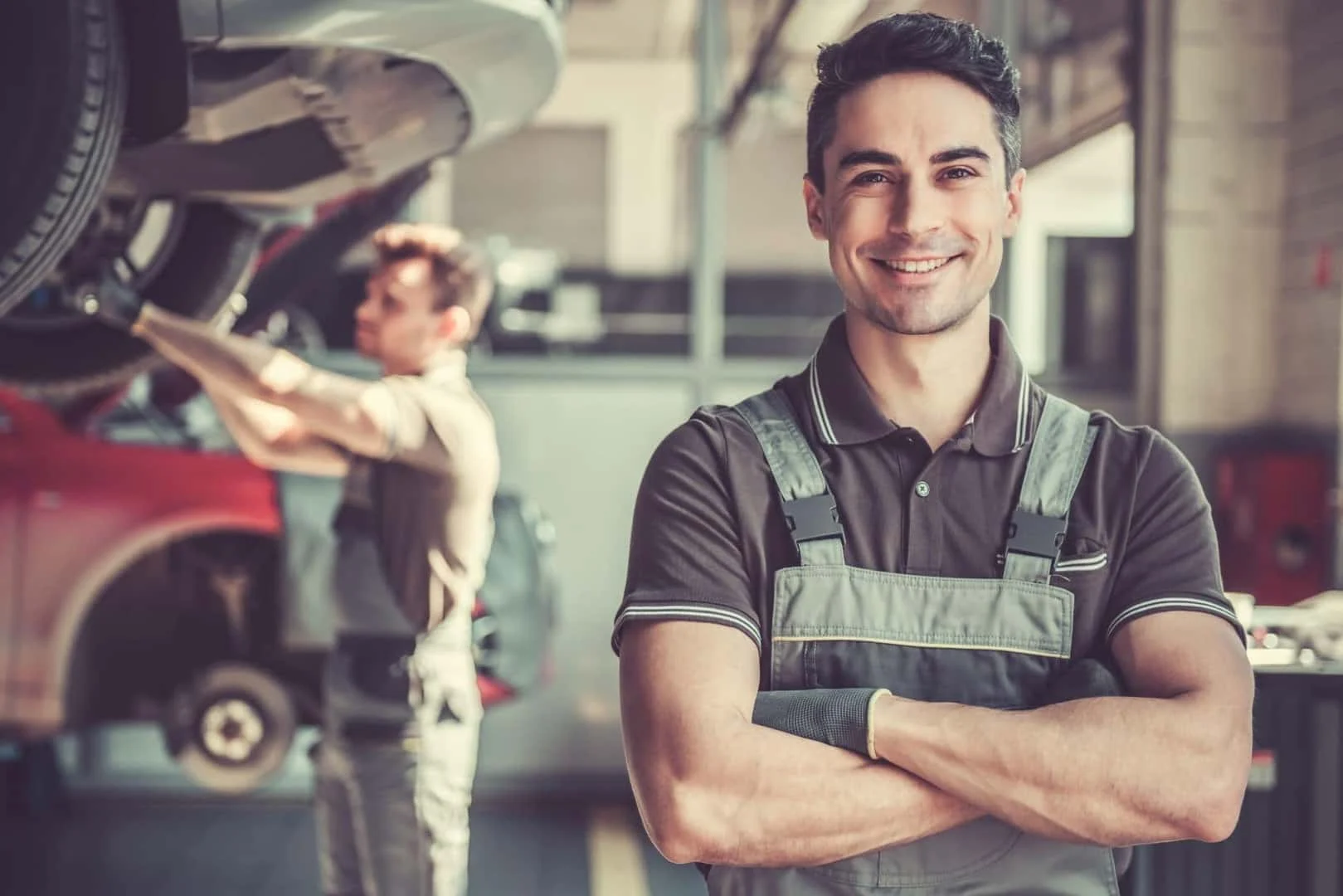Albany Motorcars service technician ready to perform a synthetic oil replacement