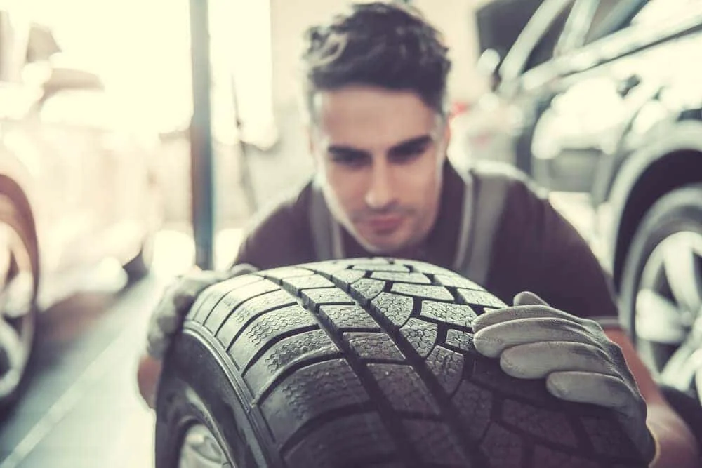 Technician performing a tire inspection