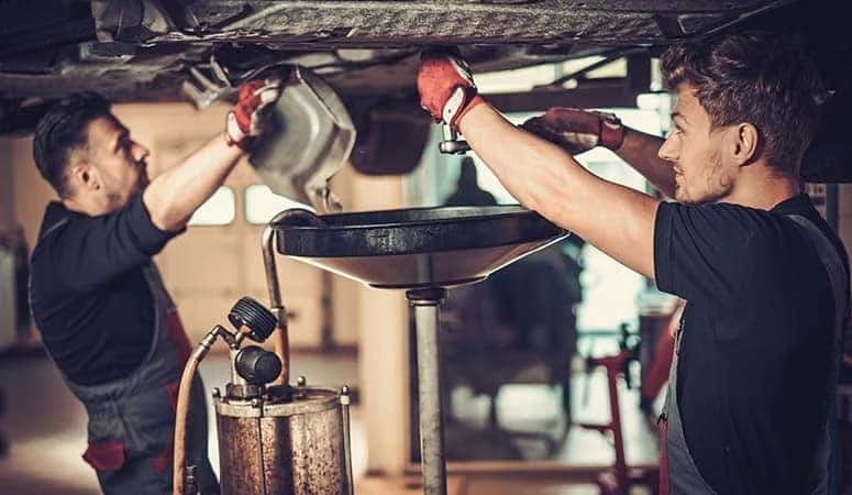 Certified technician servicing a vehicle at Albany Motorcars