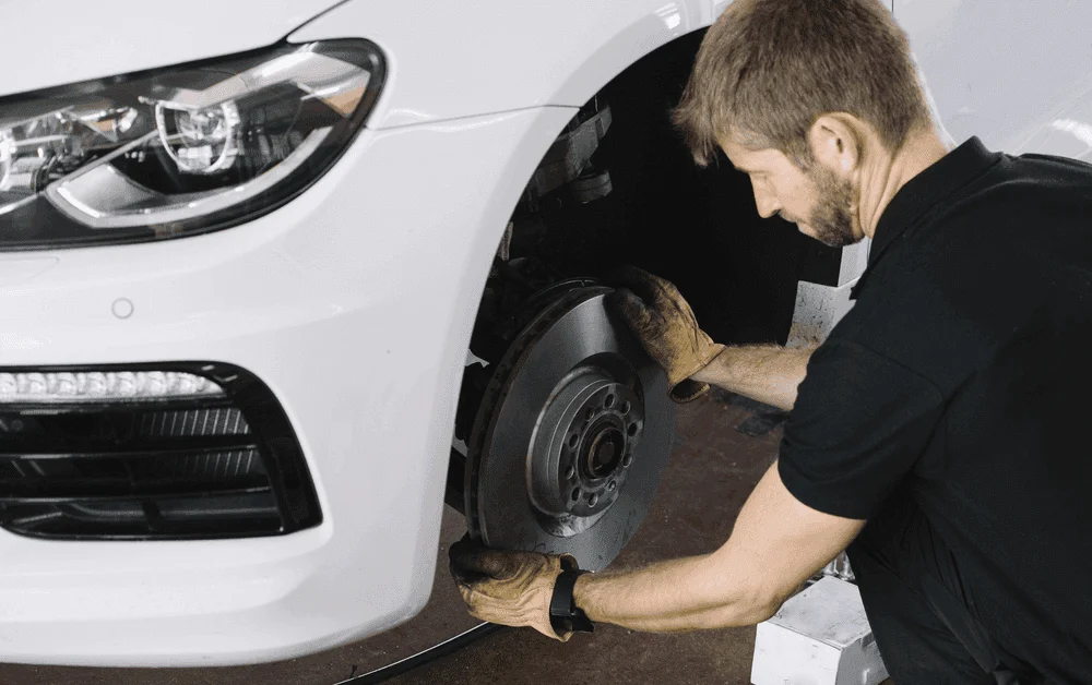 Close-up of vehicle brake rotor and caliper