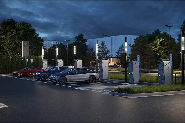 Three Mercedes-Benz sedans charging in a parking lot
