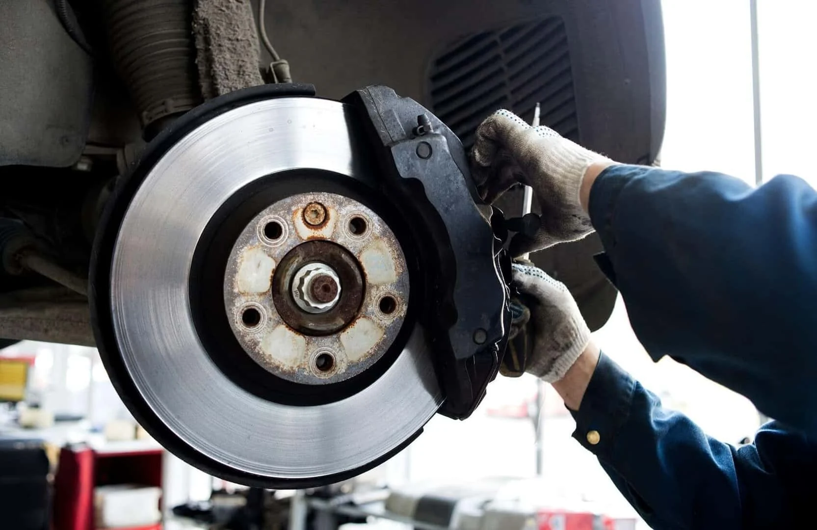 Technician performing brake repair service near Leesburg, GA