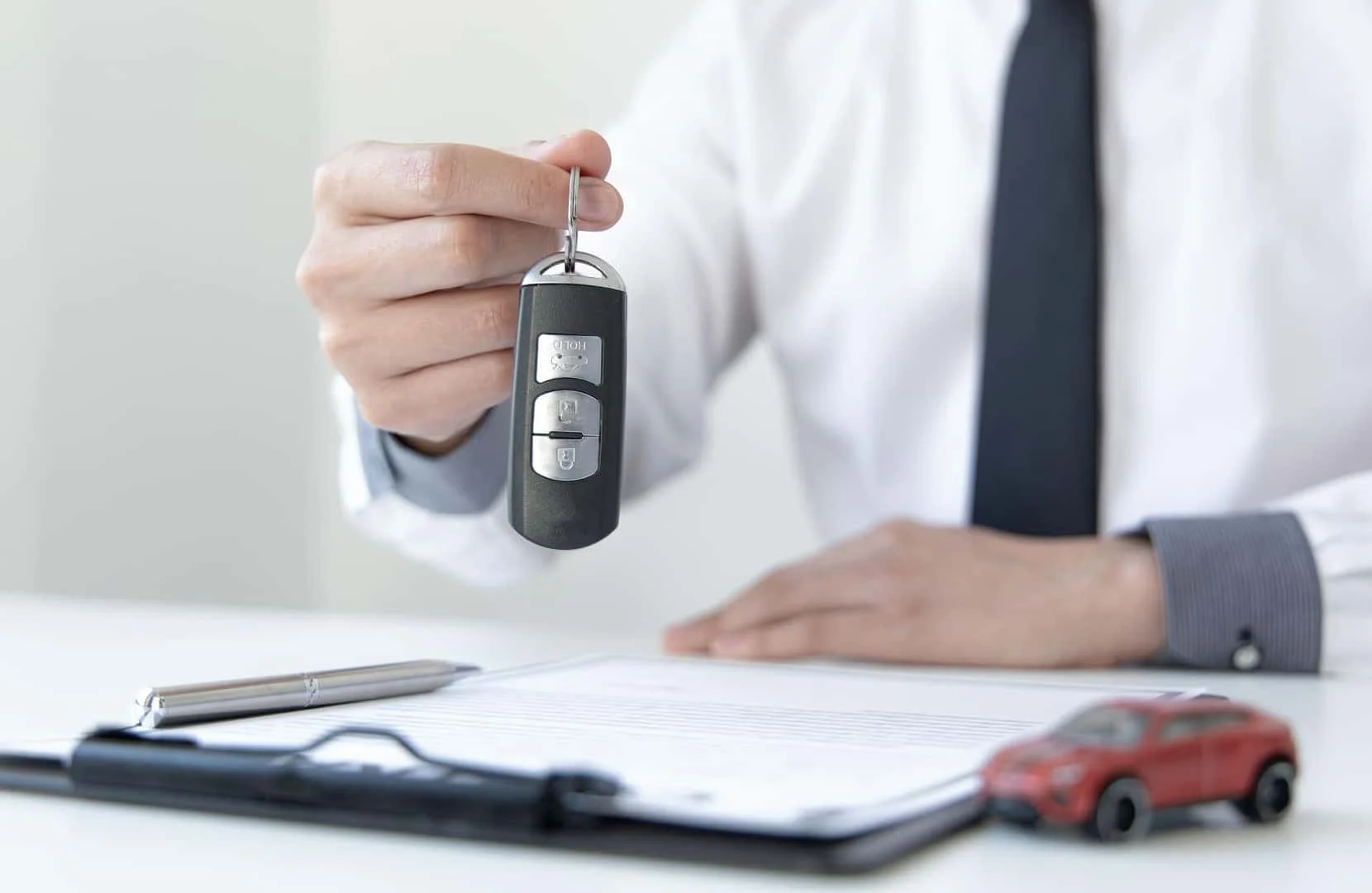 Driver reviewing pre-owned car buying resources